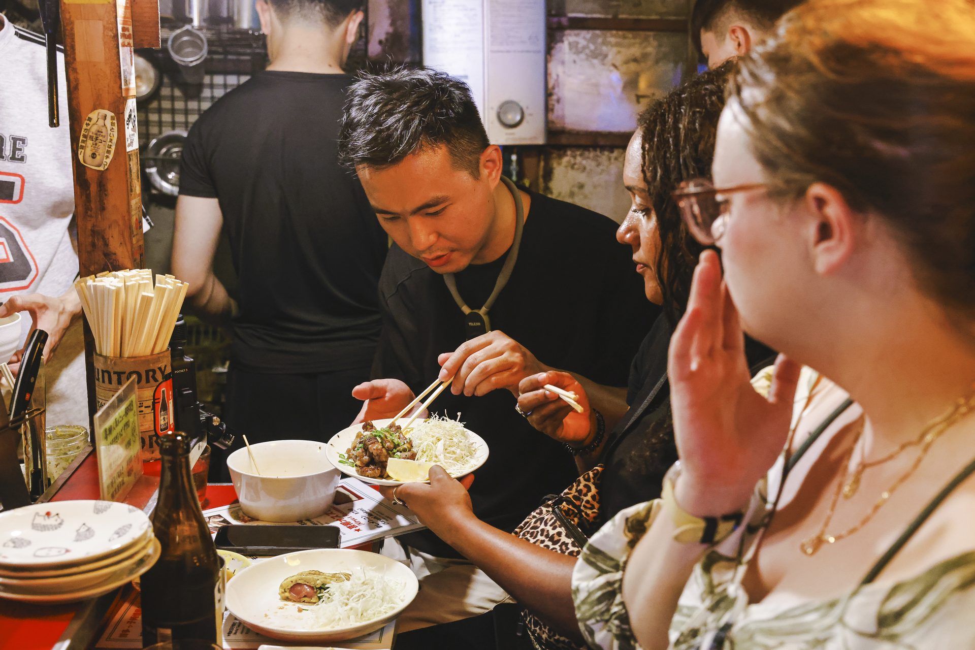 Guests eating at an authentic local izakaya